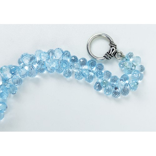 110A - A TOPAZ SINGLE STRAND FACETED BEAD NECKLACE, the Swiss blue topaz stones of pear shape and multiface... 