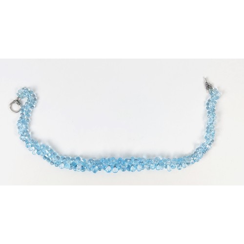 110A - A TOPAZ SINGLE STRAND FACETED BEAD NECKLACE, the Swiss blue topaz stones of pear shape and multiface... 