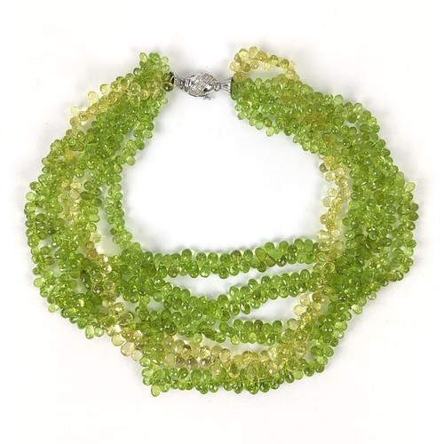 115A - A PERIDOT FIVE STRAND FACETED BEAD NECKLACE, the peridot stones of pear shape and multifaceted, fitt... 