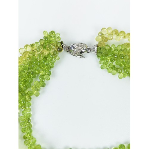 115A - A PERIDOT FIVE STRAND FACETED BEAD NECKLACE, the peridot stones of pear shape and multifaceted, fitt... 