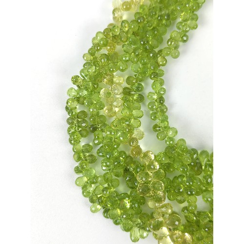 115A - A PERIDOT FIVE STRAND FACETED BEAD NECKLACE, the peridot stones of pear shape and multifaceted, fitt... 