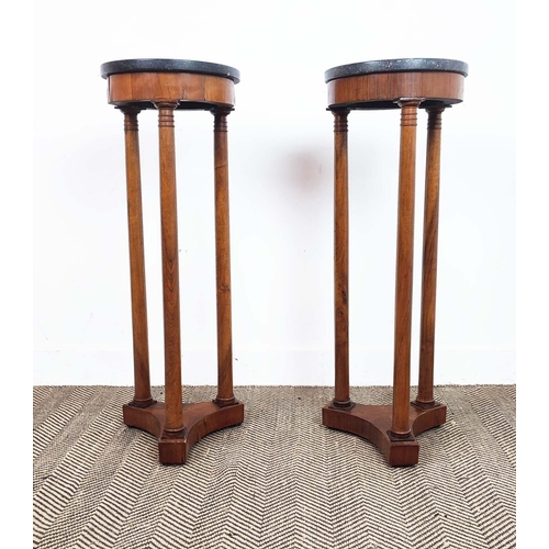 151 - GUERIDONS, a pair, 19th century Empire revival, each with a black circular marble top, each 90cm H x... 