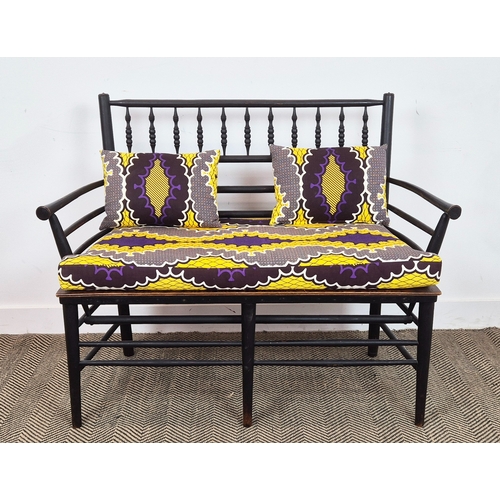 194 - WILLIAM MORRIS STYLE SUSSEX BENCH, ebonised and turned wooden frame with later seat and upholstered ... 