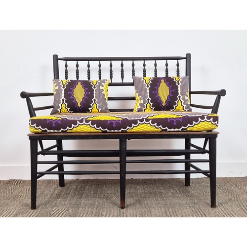 194 - WILLIAM MORRIS STYLE SUSSEX BENCH, ebonised and turned wooden frame with later seat and upholstered ... 