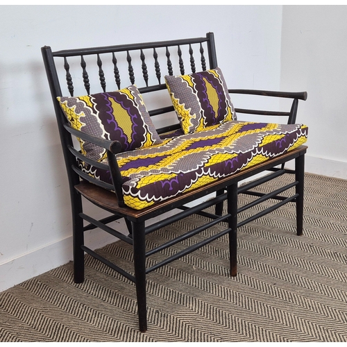 194 - WILLIAM MORRIS STYLE SUSSEX BENCH, ebonised and turned wooden frame with later seat and upholstered ... 