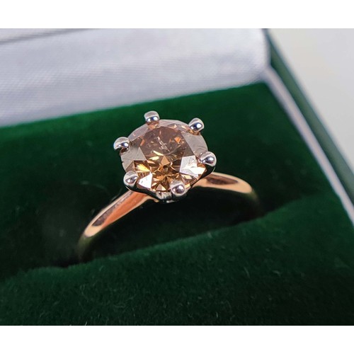 108 - AN 18CT ROSE AND WHITE GOLD FANCY DIAMOND SOLITAIRE RING, the fancy orangish brown round brilliant c... 