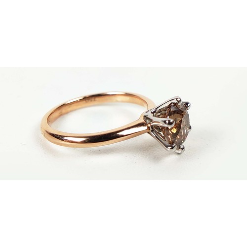 108 - AN 18CT ROSE AND WHITE GOLD FANCY DIAMOND SOLITAIRE RING, the fancy orangish brown round brilliant c... 