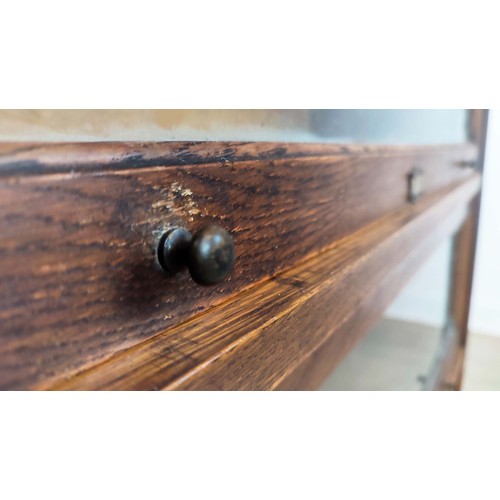 263 - THE LEBUS BOOKCASE, Edwardian oak in sections of three glazed doors, 124cm H x 88cm W x 36cm D.