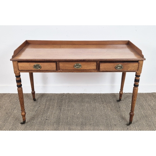 145 - WRITING TABLE, George IV mahogany and ebonised with three quarter gallery top over three frieze draw... 