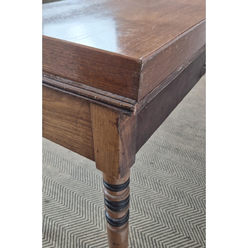 145 - WRITING TABLE, George IV mahogany and ebonised with three quarter gallery top over three frieze draw... 