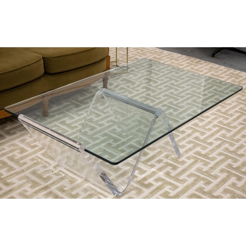 496 - LOW TABLE, rectangular glass top on perspex support, 42cm H x 120cm W x 76cm D.