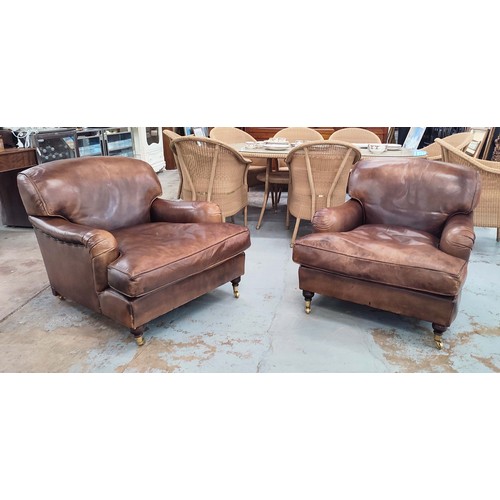 195 - ARMCHAIRS, a pair, Howard style brown leather, each 85cm W x 81cm H x 105cm D. (2)