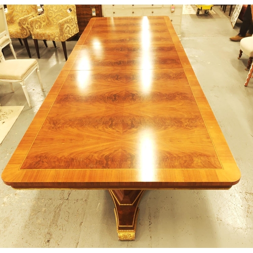 123 - DINING TABLE, Regency style mahogany with gilt details on triform pedestal bases, 76cm H x 236cm L x... 