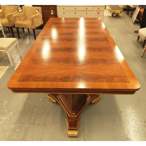 123 - DINING TABLE, Regency style mahogany with gilt details on triform pedestal bases, 76cm H x 236cm L x... 