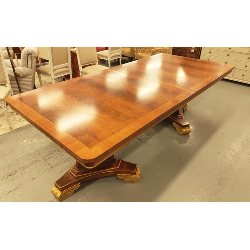 123 - DINING TABLE, Regency style mahogany with gilt details on triform pedestal bases, 76cm H x 236cm L x... 