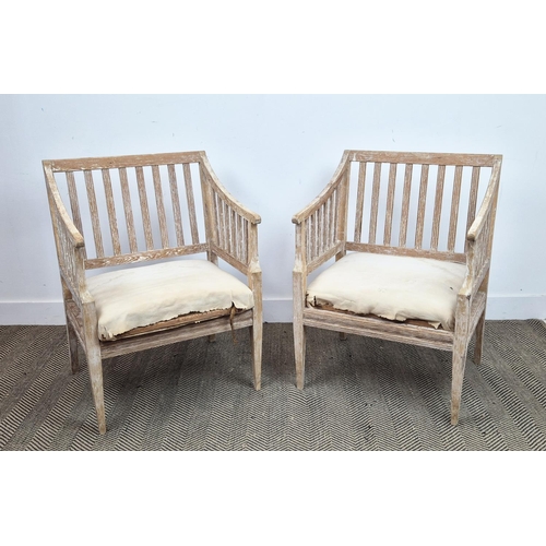 204 - CONSERVATORY ARMCHAIRS, a pair, in pine, in a stripped finish, each 61cm W x 85cm D x 53cm. (2)