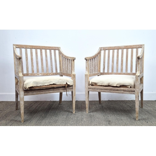 204 - CONSERVATORY ARMCHAIRS, a pair, in pine, in a stripped finish, each 61cm W x 85cm D x 53cm. (2)