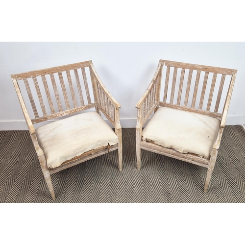 204 - CONSERVATORY ARMCHAIRS, a pair, in pine, in a stripped finish, each 61cm W x 85cm D x 53cm. (2)