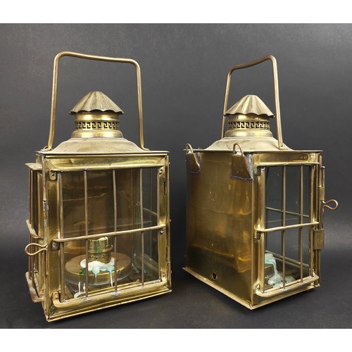 197 - LANTERNS, a pair, brass and glass with carrying handles, each 25cm W x 18cm D x 42cm tall overall. (... 