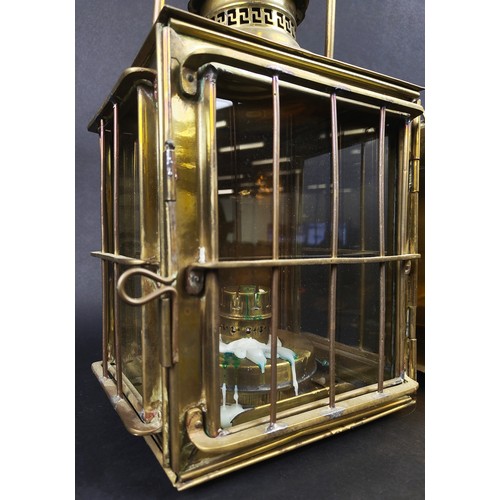 197 - LANTERNS, a pair, brass and glass with carrying handles, each 25cm W x 18cm D x 42cm tall overall. (... 