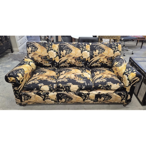 150 - SOFA, in a black and gold bird fabric, approx 190cm W x 88cm H.