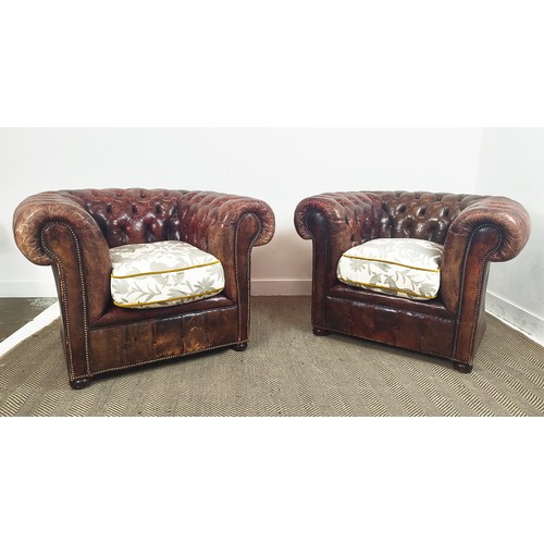 480 - ARMCHAIRS, a pair, Chesterfield design, leather upholstered, patterned fabric upholstered seats, 110... 