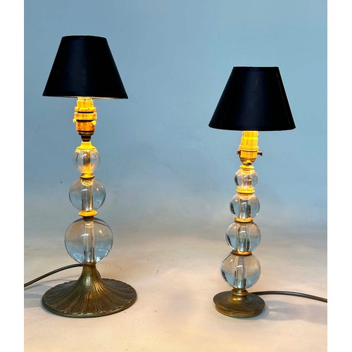 216 - TABLE LAMPS, two with lead crystal-glass columns each with gilt metal base, taller 46cm H. (2)