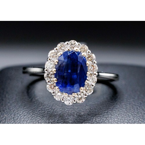 43 - CERTIFICATED 18CT WHITE GOLD OVAL KYANITE AND DIAMOND CLUSTER RING, kyanite 1.77ct, RBC diamonds 0.5... 