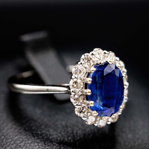 43 - CERTIFICATED 18CT WHITE GOLD OVAL KYANITE AND DIAMOND CLUSTER RING, kyanite 1.77ct, RBC diamonds 0.5... 