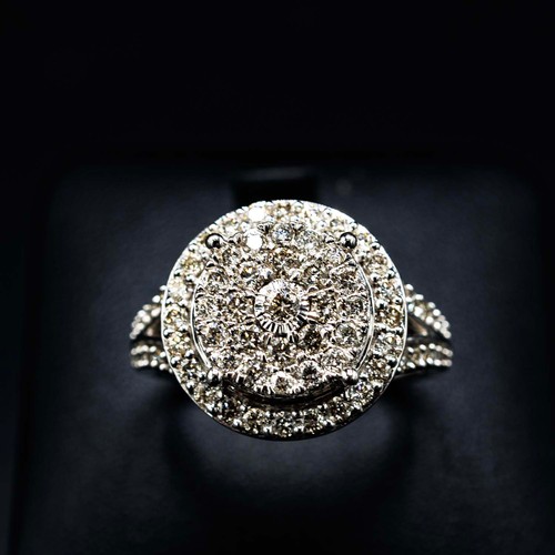 48 - LARGE 9CT WHITE GOLD DIAMOND CLUSTER RING, with diamond-set shoulders, RBC diamonds 1.00ct.