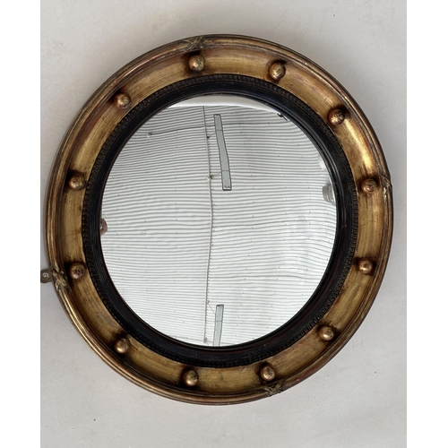 150 - WALL MIRROR, Regency style giltwood and gesso circular bevelled with ball encrusted frame and ebonis... 