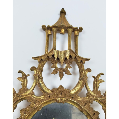 168 - WALL MIRROR, Chinese Chippendale style giltwood with oval plate and pagoda crest, 137cm H x 87cm.