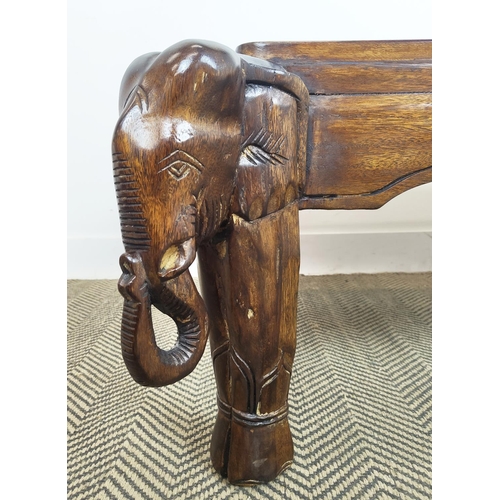 171 - LOW TABLE, rectangular hardwood on carved elephant supports, 43cm H x 119cm x 70cm.