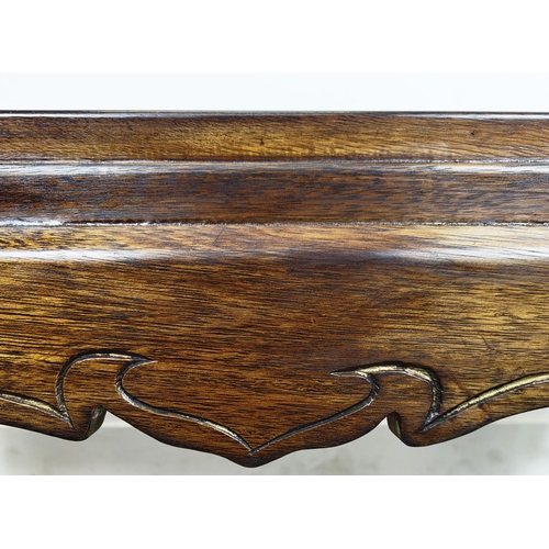 171 - LOW TABLE, rectangular hardwood on carved elephant supports, 43cm H x 119cm x 70cm.