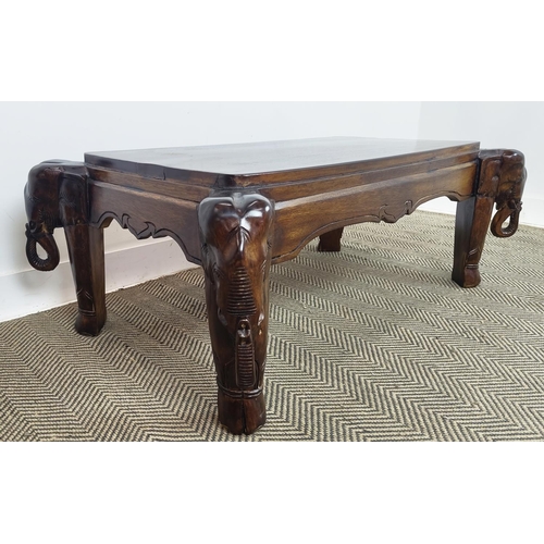 171 - LOW TABLE, rectangular hardwood on carved elephant supports, 43cm H x 119cm x 70cm.