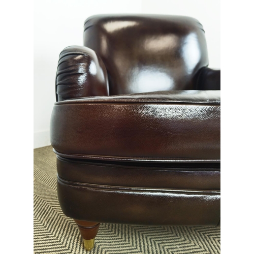 175 - HOWARD STYLE ARMCHAIR, dark brown leather with brass front castors, 89cm H x 80cm W x 105cm D.