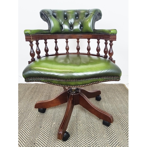 185 - DESK CHAIR, green leather with swivel seat on castors, 88cm H x 62cm.