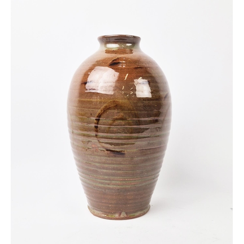 25 - A STUDIO POTTERY TERRACOTTA VASE, late 20th century, of ovoid form, contemporary spiral motfis, ribb... 