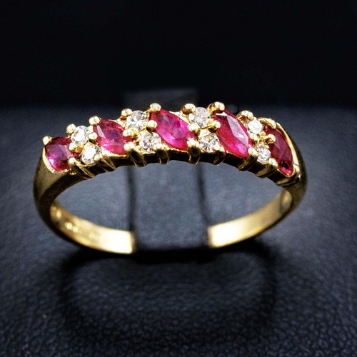 57 - 9CT YELLOW GOLD 9-STONE MARQUISE RUBY AND R/C DIAMOND RING, boxed.