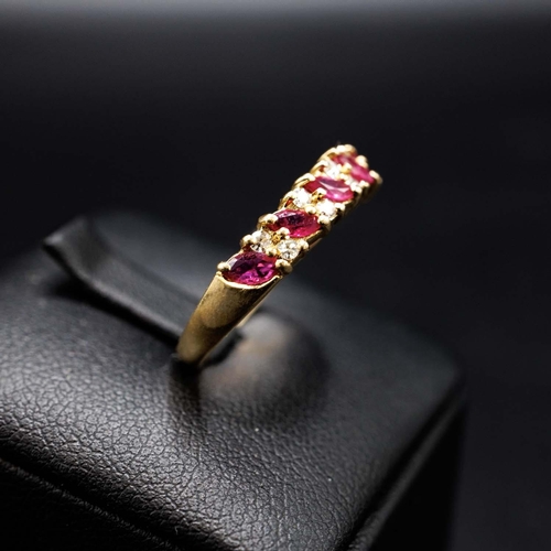 57 - 9CT YELLOW GOLD 9-STONE MARQUISE RUBY AND R/C DIAMOND RING, boxed.