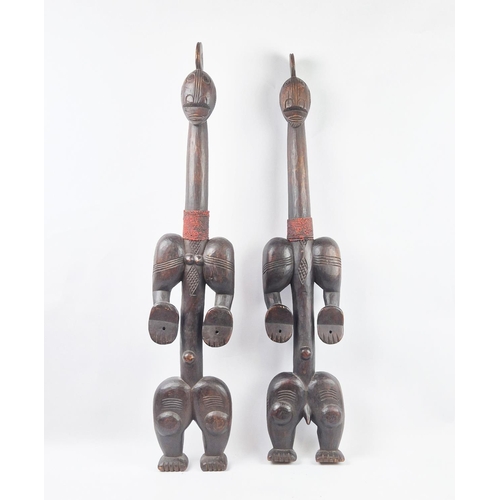 8 - BAOULÉ TRIBAL FIGURES, a pair, Ivory Coast, carved hardwood and beadwork, 100cm H. (2)