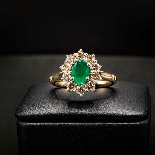 44 - OVAL EMERALD AND DIAMOND CLUSTER RING SET, in 9ct white and yellow gold, emerald 0.85ct, diamonds 0.... 