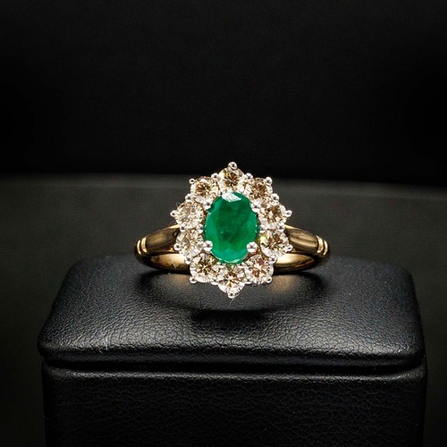 44 - OVAL EMERALD AND DIAMOND CLUSTER RING SET, in 9ct white and yellow gold, emerald 0.85ct, diamonds 0.... 