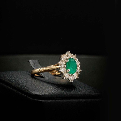 44 - OVAL EMERALD AND DIAMOND CLUSTER RING SET, in 9ct white and yellow gold, emerald 0.85ct, diamonds 0.... 