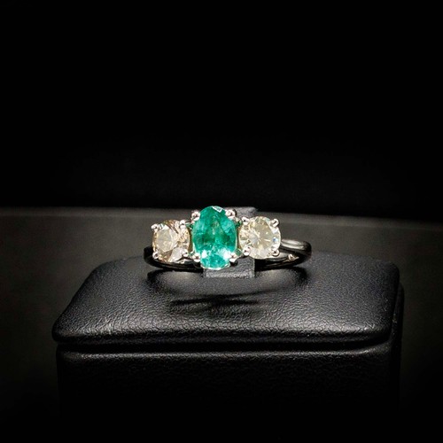 51 - CERTIFICATED 18CT WHITE GOLD EMERALD AND DIAMOND TRILOGY RING, emerald 0.66ct, diamonds 0.37ct, Cert... 