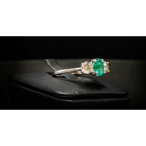 51 - CERTIFICATED 18CT WHITE GOLD EMERALD AND DIAMOND TRILOGY RING, emerald 0.66ct, diamonds 0.37ct, Cert... 