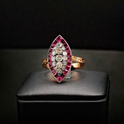 59 - UNHALLMARKED ROSE GOLD NAVETTE RING SET, with RBC diamonds and calibre cut spinel with scroll patter... 