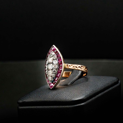 59 - UNHALLMARKED ROSE GOLD NAVETTE RING SET, with RBC diamonds and calibre cut spinel with scroll patter... 