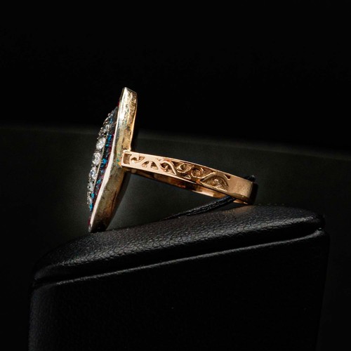 59 - UNHALLMARKED ROSE GOLD NAVETTE RING SET, with RBC diamonds and calibre cut spinel with scroll patter... 