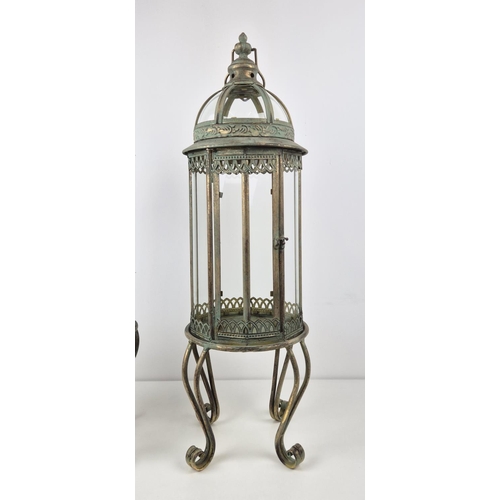 509 - LANTERNS ON STANDS, a pair, with a faux verdigris finish, 82cm H. (2)